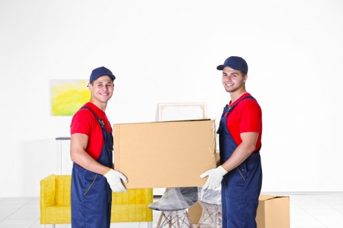 Moving team loading furniture safely into a van