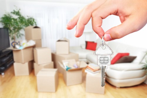 Loading household furniture into a removal truck in east London