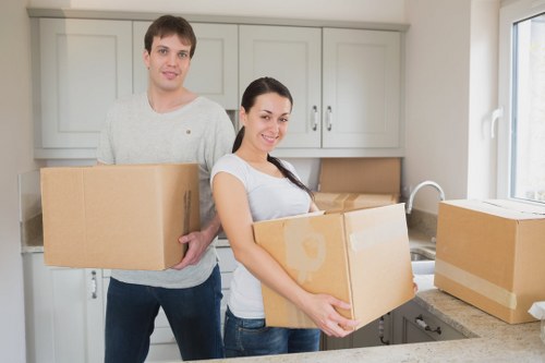 Commercial moving truck transporting office equipment in Dagenham